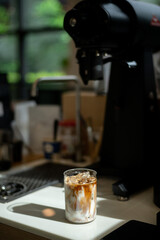 Coffee in a glass on the counter of a coffee shop