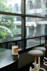 Coffee in a glass on the counter of a coffee shop