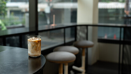 Coffee in a glass on the counter of a coffee shop