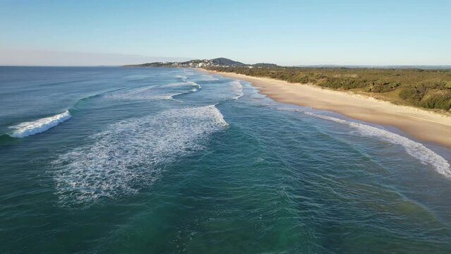 Flying Above Waves Rolling In The Sea At Coolum Beach In Sunshine Coast, Queensland. aerial