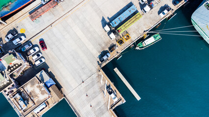 Container ship in import - export business industry in Sriracha industrial port, Thailand.