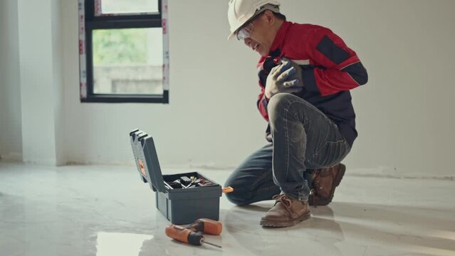 Asian senior maintenance engineer opening toolbox near construction site I have a sudden illness.