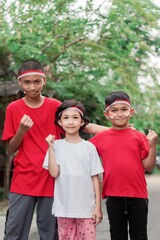 Indonesian kids boy and girl celebrate independence day at outdoor