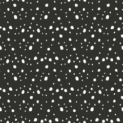 Ditsy seamless pattern with white dots on black background