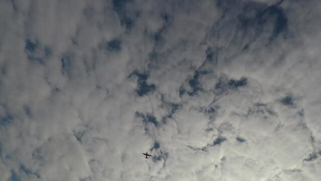 military transport plane dropping paratroopers