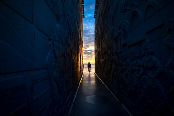 Silhouette of a man with a bicycle at the end of the tunnel of Nghinh Phong tower in Phu Yen...