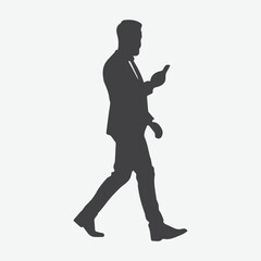 Elegant and Modern Businessman in Suit and Jeans, Silhouette of a Man Engaged with Mobile Phone while Walking