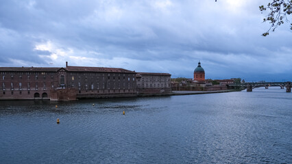 View of the banks of the Garonne River in Toulouse. In the background, the Hôpital de La Grave (Grave Hospital) second largest hospital establishment during much of the 20th century.