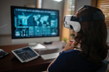 Futuristic women Engineer Wearing Virtual Reality Glasses working with a futuristic hologram to...