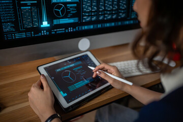 Futuristic women Engineer working with Holographic Augmented Reality and 3D Wind Turbine Model on tablet at home office ,Concept of technology and environment