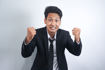 Angry, tired, grumpy, grumpy young office manager or annoyed business man losing control and screaming hysterically isolated on white background
