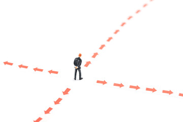 A businessman with a blurred direction in the miniature world