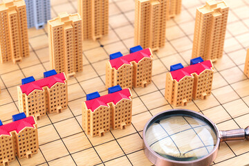Study the real estate model on the chessboard with a magnifying glass