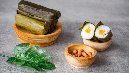 Lontong is indonesian traditional food, lontong or lontong isi. It made from rice filled with vegetables and wrapped inside a banana leaf and boiled