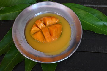 Mango slice. Mango is also called the king of fruits. This fruit is a popular and delicious fruit all over the world. It's other names Mangifera indica. Ripe mango.
