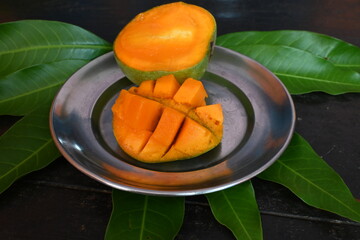Mango slice. Mango is also called the king of fruits. This fruit is a popular and delicious fruit all over the world. It's other names Mangifera indica. Ripe mango.