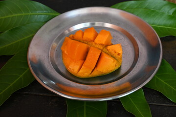 Mango slice. Mango is also called the king of fruits. This fruit is a popular and delicious fruit all over the world. It's other names Mangifera indica. Ripe mango.