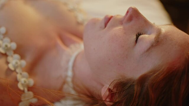 Beautiful woman wearing lingerie turning her head away from camera