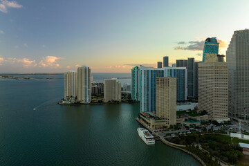 Aerial view of downtown district of of Miami Brickell in Florida, USA at sunset. High commercial and residential skyscraper buildings in modern american megapolis