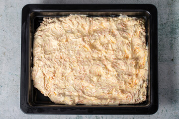 Carrot salad with yogurt on gray background. Salad prepared with yogurt, grated carrots, walnuts, olive oil, grated garlic and salt. healthy appetizers. Local name havuc tarator