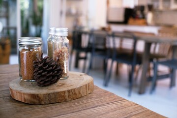 Sugar for hot coffee on wooden table.