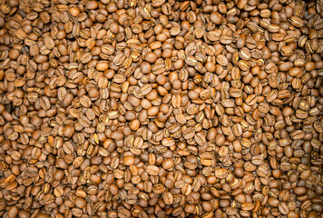 Roasted coffee beans background. Close up of coffee beans background.