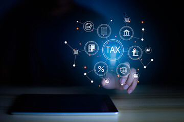 income tax concept. Businessman pointing to tax icon. income tax system icon around. pay online income tax. futuristic virtual screen interface technology.
