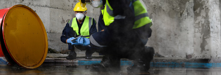 Two Officers of Environmental Engineering wearing masks inspected Oil Spill.