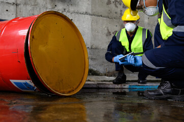 Two Officers of Environmental Engineering wearing masks inspected Oil Spill.