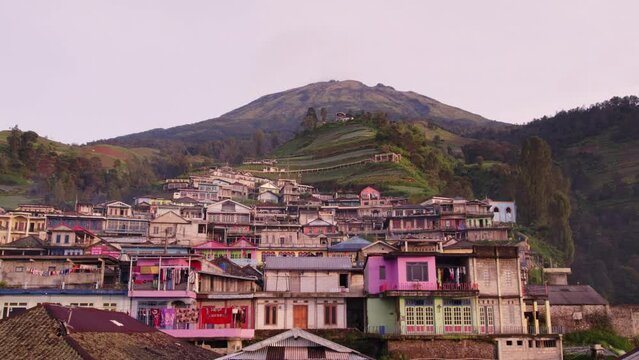 Low flying shot of Nepal van java colourful village Indonesia, aerial