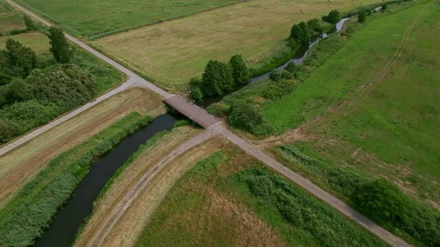 Aerial shot - orbit around a bridge and a river.