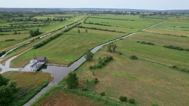 Orbit around rivers and a building in Polish nature reserve "Beka".