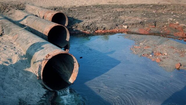 Large metal pipes through which harmful chemical waste is dumped.