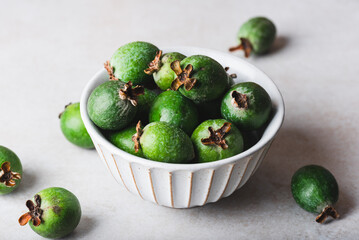 Vintage bowl full of green feijoa fruit