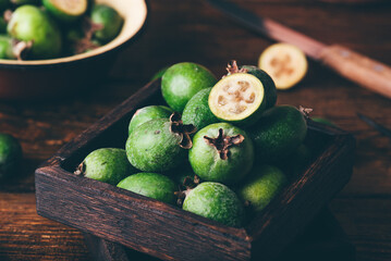 Feijoa fruit in a rustic wooden box