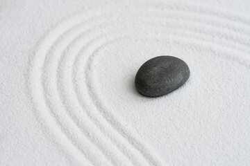 Fototapeta na wymiar Zen Graden with Grey Stone on White Sand Line Texture Background, Top View Black Rock Sea Stone on Sand Wave Parallel Lines Pattern in Japanese stye, Banner for Harmony,Meditation,Zen like concept