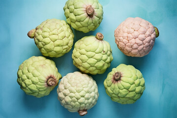 Top view of whole Custard Apple fruits on pink background.