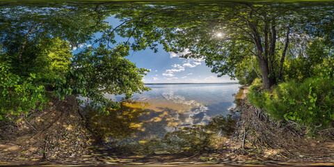 seamless spherical hdri 360 panorama on coast among bushes of huge lake or river with frame of...