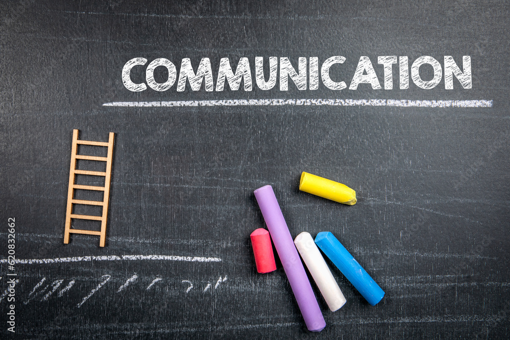 Canvas Prints communication concept. colored pieces of chalk and text on a dark chalkboard background
