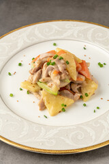 Hot and sour chicken sauteed with carrots, potatoes and zucchini. Asian Cuisine