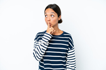 Young hispanic woman isolated on white background showing a sign of silence gesture putting finger...