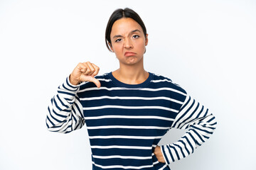Young hispanic woman isolated on white background showing thumb down with negative expression