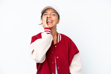 Young hispanic woman wearing a baseball uniform isolated on white background shouting with mouth wide open