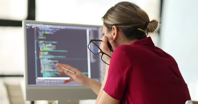Woman programmer conducts remote self-test and IT. Design skills and online html text for cybersecurity staff