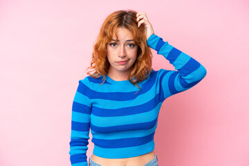 Young caucasian woman isolated on pink background with an expression of frustration and not...