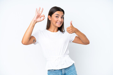 Young caucasian woman isolated on white background showing ok sign and thumb up gesture