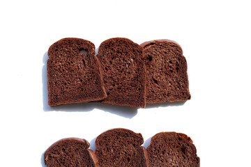 Dark cocoa bread on white background.