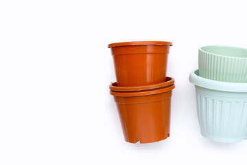 Plastic plant pots, containers on white background.