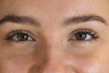 Close up portrait of eyes of smiling caucasian woman