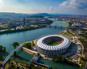 Fotobehang Budapest, Hungary - Aerial view of Budapest on a sunny summer day, including National Athletics Centre, Rakoczi bridge, Kopaszi gat and MOL Campus new skyscraper building at background with blue sky © zgphotography